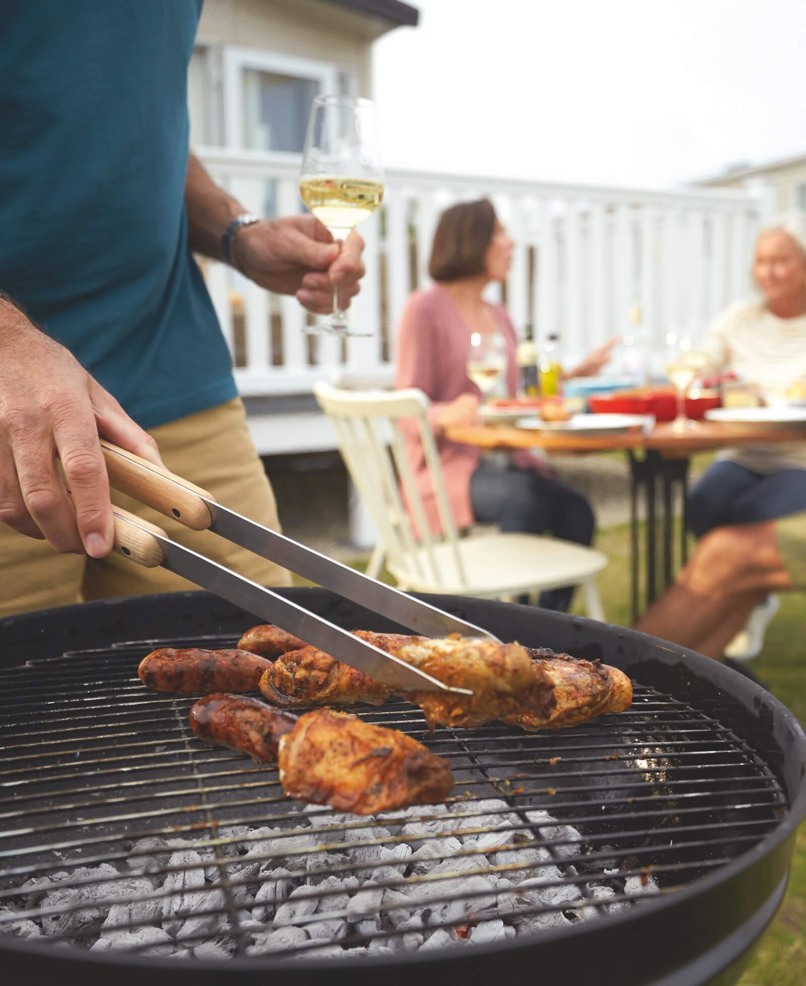 Man cooking on a barbeque.