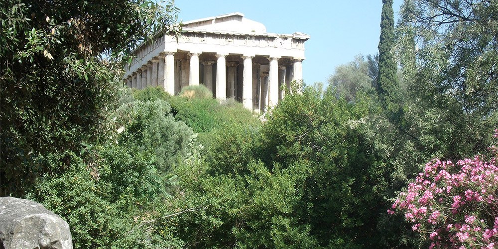 Ancient Greek building surrounded by trees