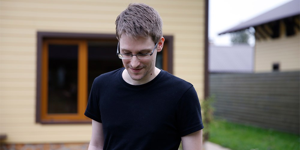 Edward Snowdon in front of a house